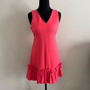 This is a Chelsea28 Ruffle Hem Sheath Dress in the color Coral Sands Size 0P